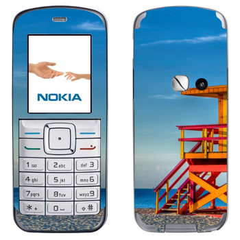   «    »   Nokia 6070