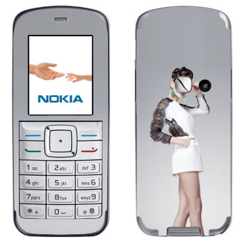   «    »   Nokia 6070